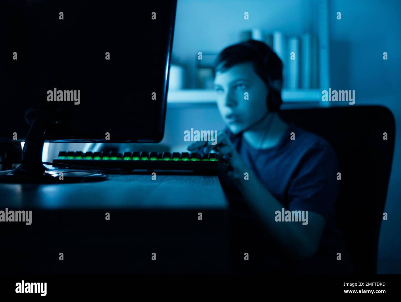 young boy playing computer Stock Photo