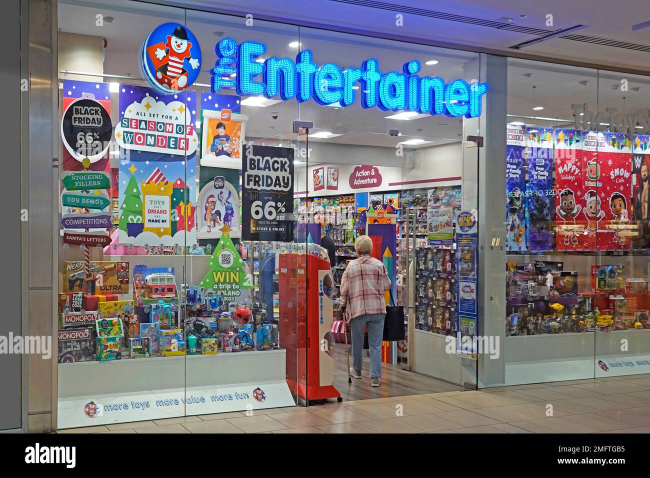Entertainer retail toy shop front Xmas window display & business brand sign above entrance in Lakeside shopping centre store indoor shopping mall UK Stock Photo