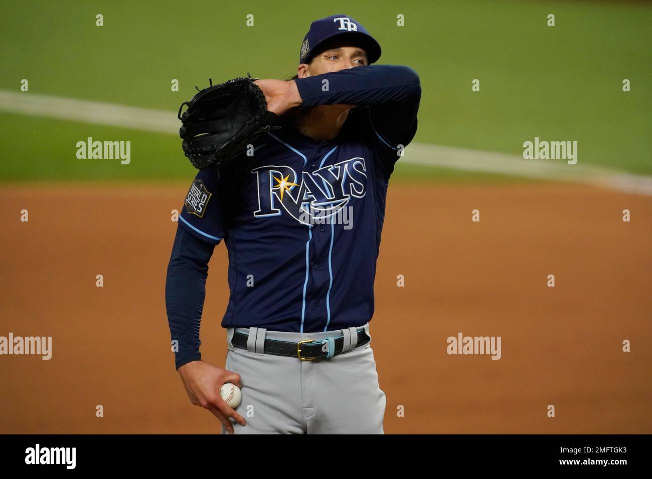 Tampa Bay Rays starting pitcher Tyler Glasnow wipes his face after