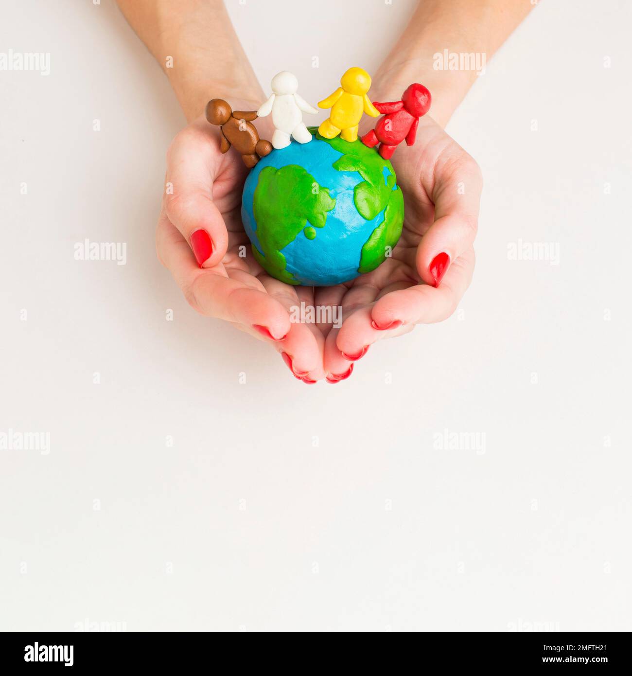 Hands holding globe hi-res stock photography and images - Alamy