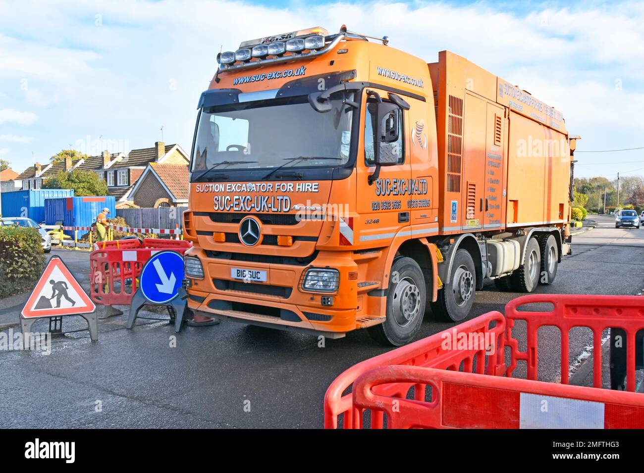 Empty cab of hgv lorry truck moving slowly between road works obstructions under external driver remote control steering to next gas main location UK Stock Photo
