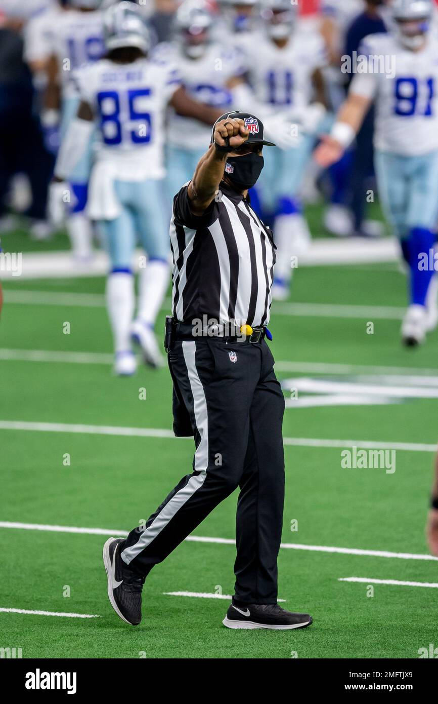 Field judge Joe Blubaugh signals during an NFL football game between