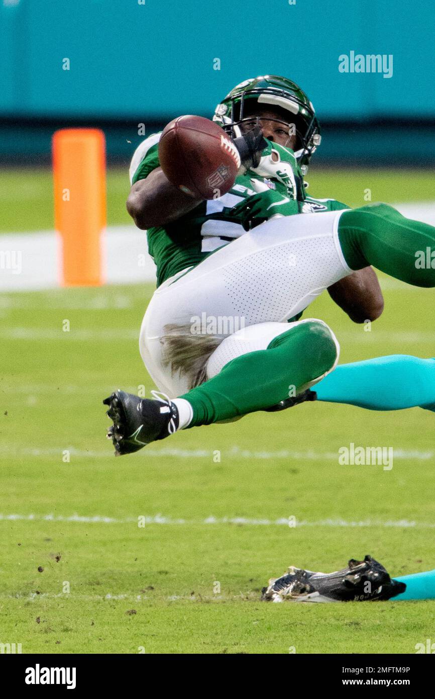 New York Jets safety Marcus Maye (20) intercepts a pass intended for Miami  Dolphins wide receiver Preston Williams (18) during an NFL football game,  Sunday, Oct. 18, 2020, in Miami Gardens, Fla. (