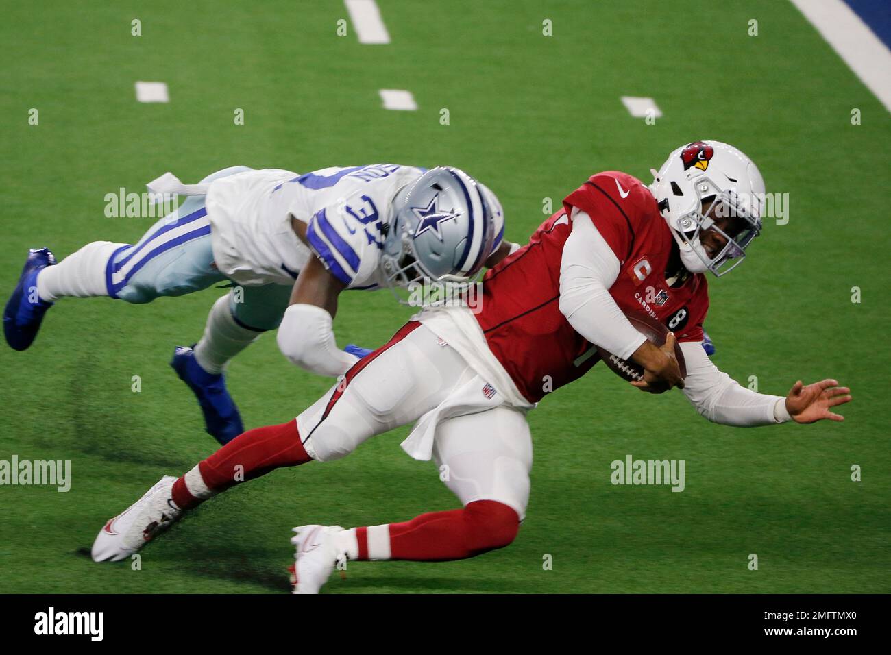 Dallas Cowboys safety Donovan Wilson (37) stops Arizona Cardinals  quarterback Kyler Murray (1) as he carries the ball in the first half of an  NFL football game in Arlington, Texas, Monday, Oct.