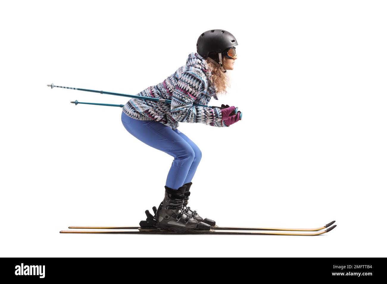 Full length profile shot of a woman skiing isolated on a white background Stock Photo