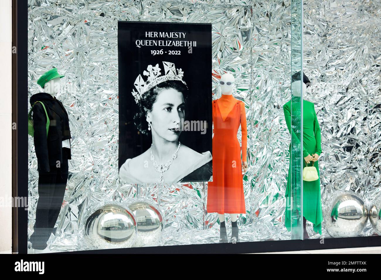 A portrait of Queen Elizabeth II is displayed in a shop window in ...
