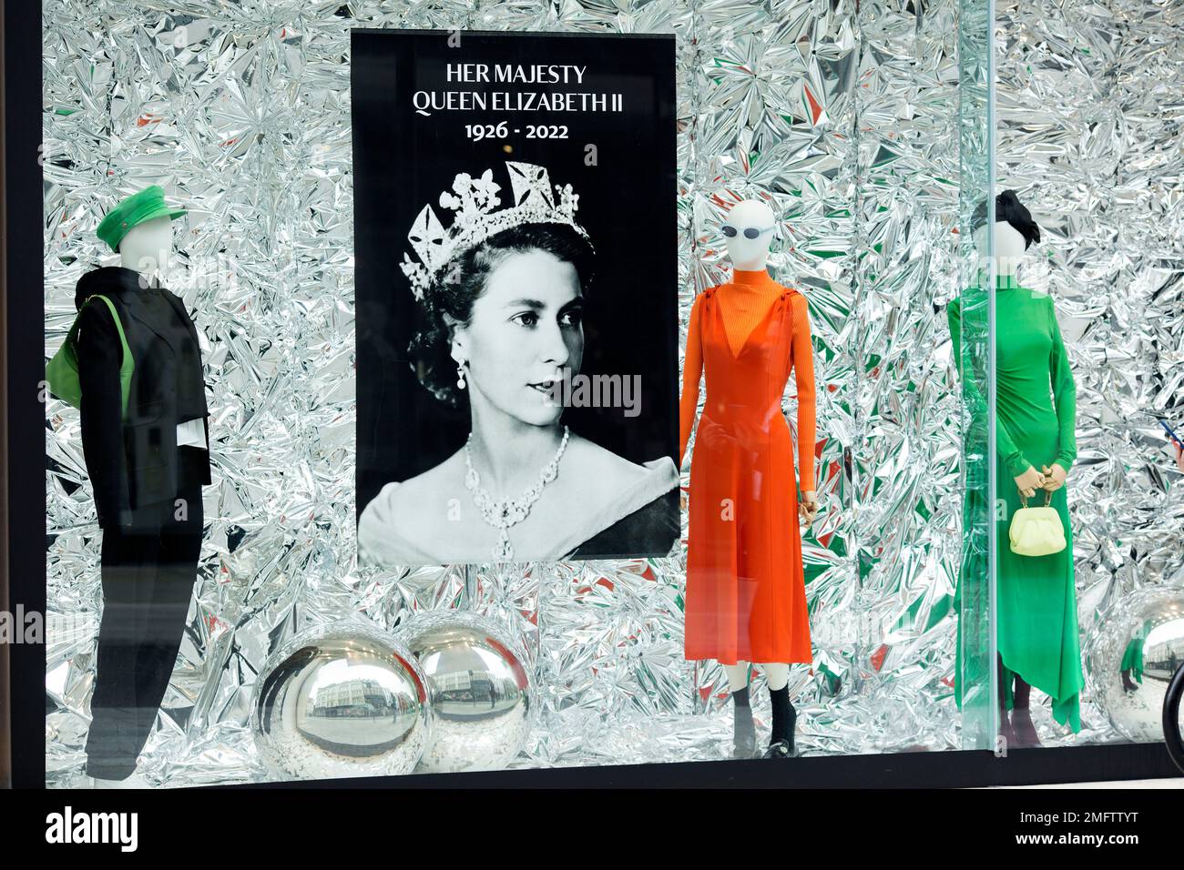 A portrait of Queen Elizabeth II is displayed in a shop window in ...