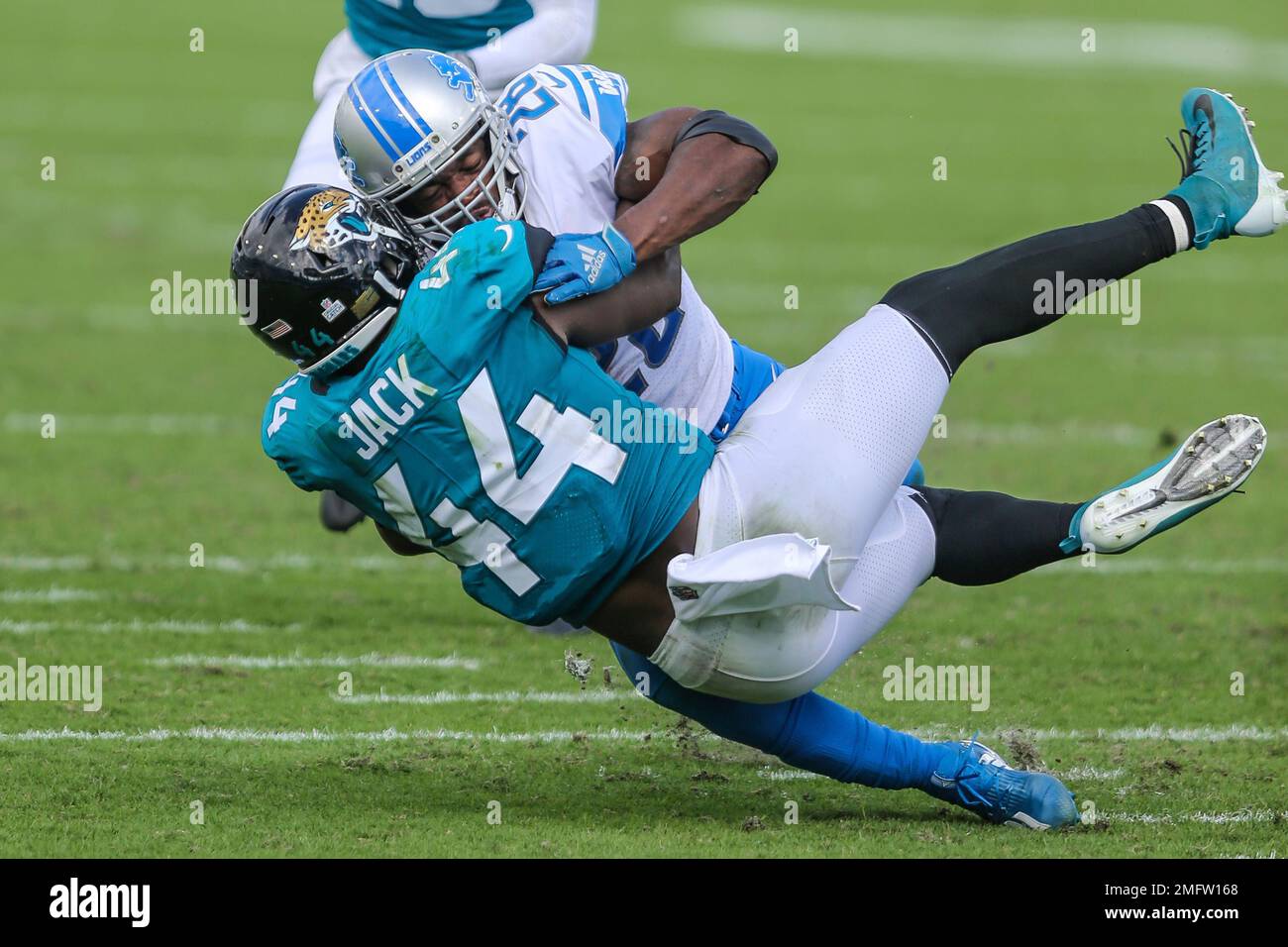 Detroit Lions running back Adrian Peterson (28) is tackled by Jacksonville  Jaguars linebacker Myles Jack (44) during an NFL football game, Sunday,  Oct. 18, 2020, in Jacksonville, Fla. (AP Photo/Gary McCullough Stock Photo  - Alamy