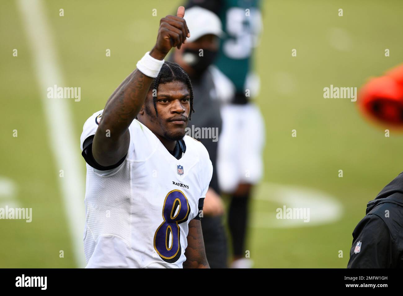 Lamar Jackson of the Baltimore Ravens walks off of the field after