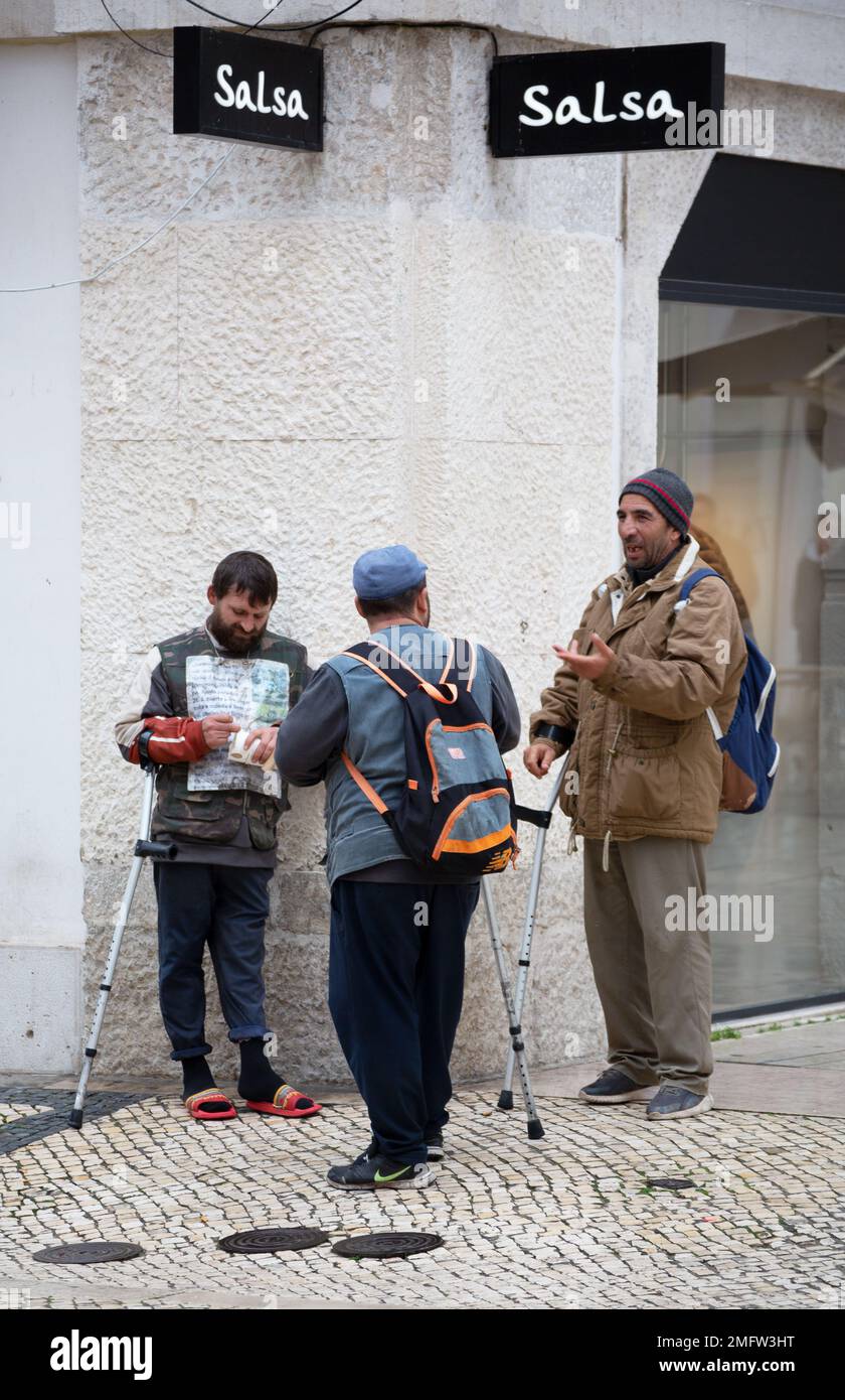 homeless people begging on the streets of the city Stock Photo