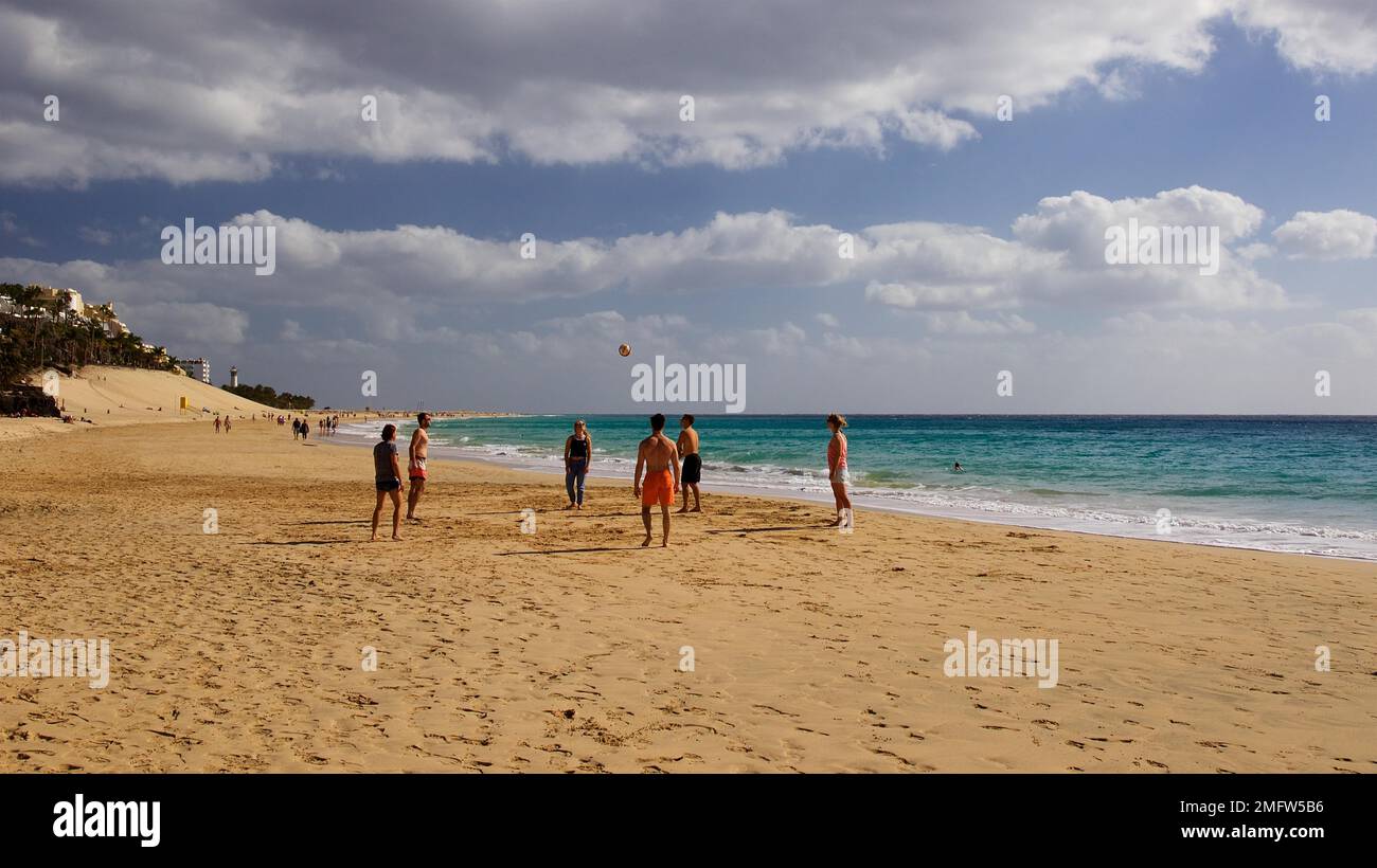 Beach, group of young people playing ball, southeast, Jandia, sandy
