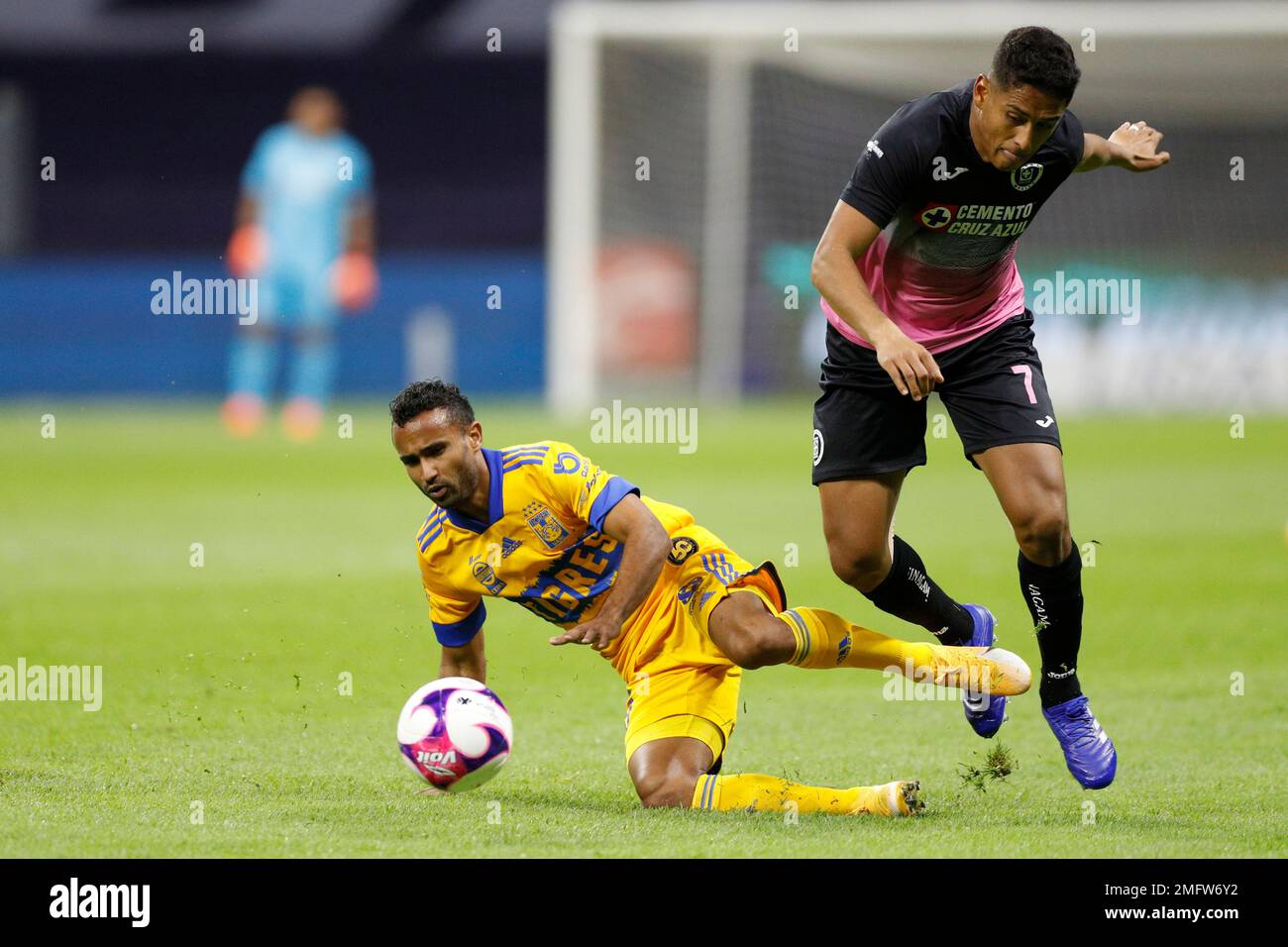 Cruz Azul s Luis Romo right and Tigres Jordan Sierra fight for the ball during a Mexican soccer league match at Azteca stadium in Mexico City Saturday Oct. 17 2020. The match was