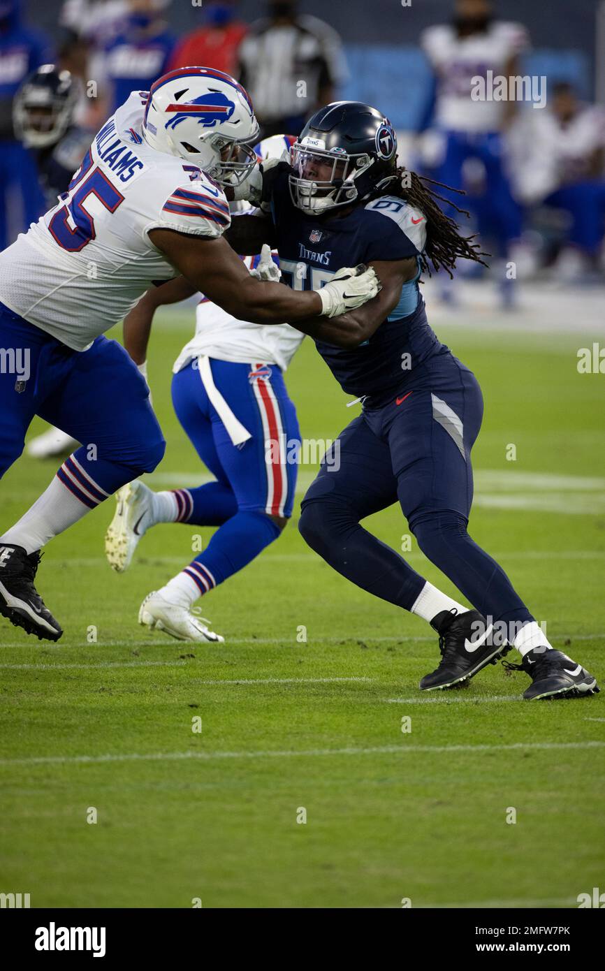 Buffalo Bills offensive tackle Daryl Williams (75) blocks Tennessee Titans  outside linebacker Jadeveon Clowney (99) during