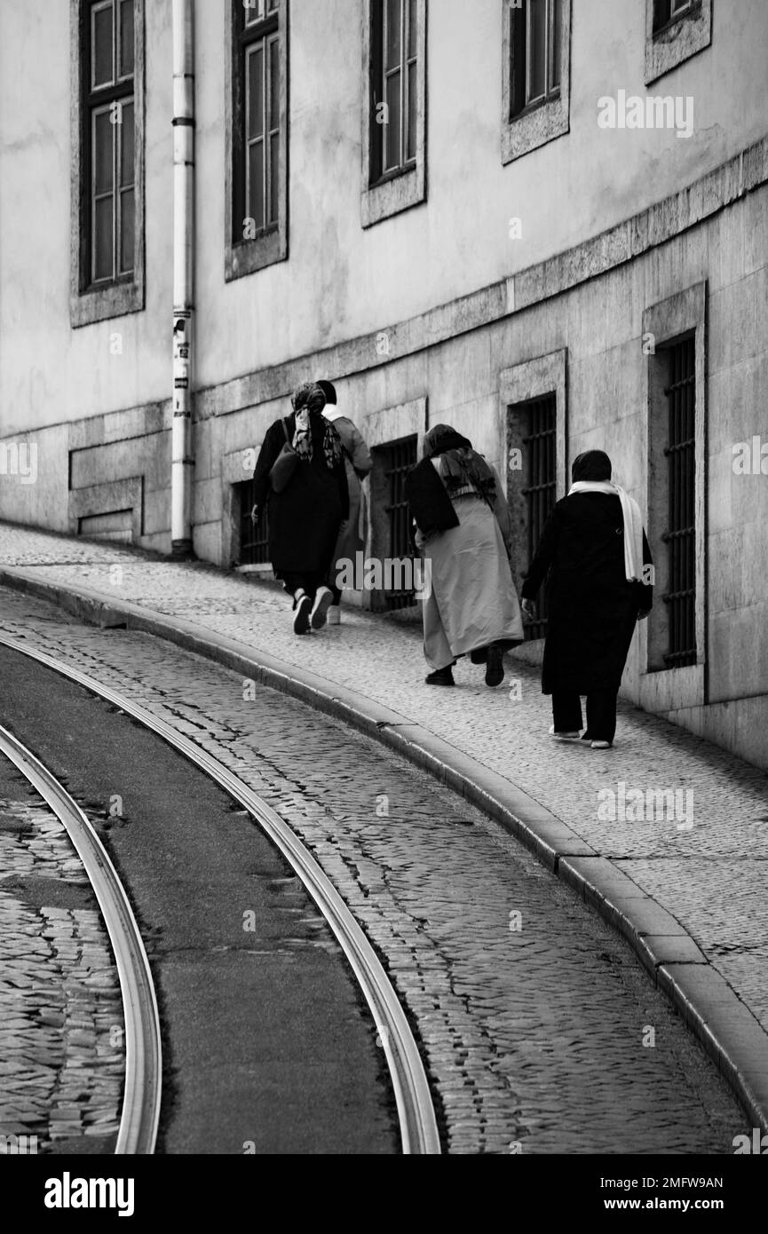 Muslim women walk the streets of Lisbon Stock Photo