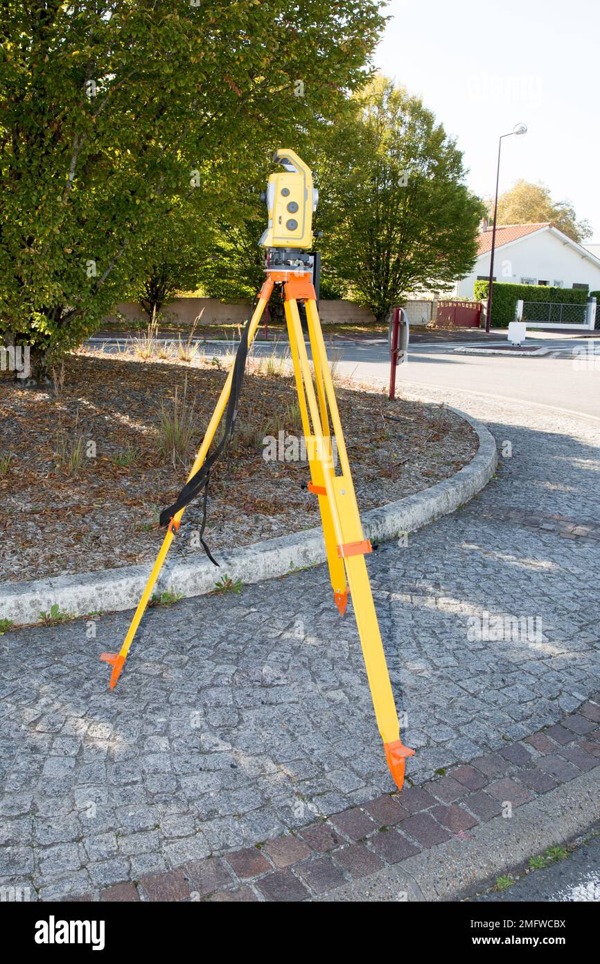surveyor at work with an infrared reflector used for distance