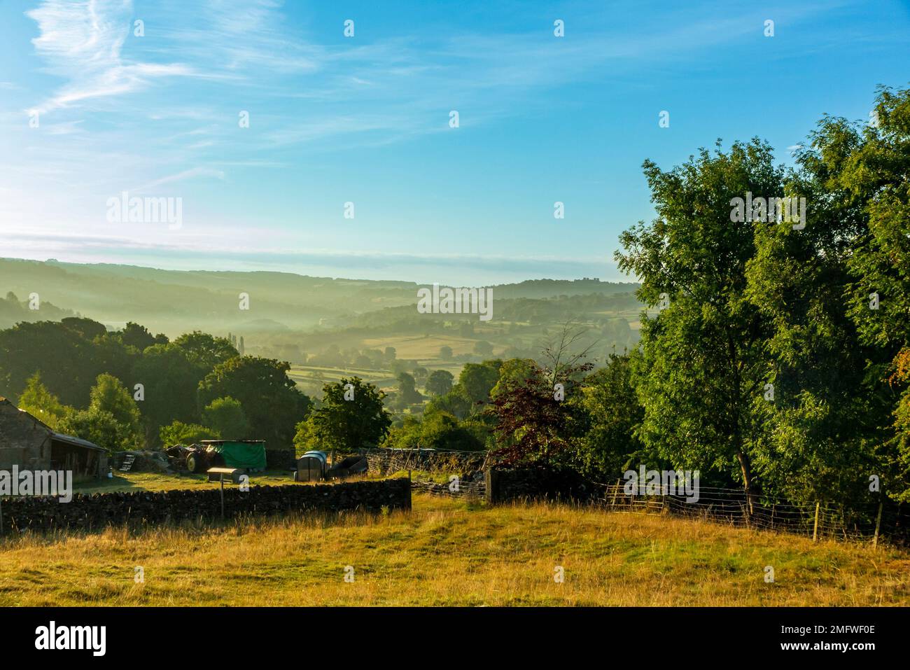 Misty morning in rolling countryside near Wensley in the Derbyshire Dales area of the Peak District National Park, Derbyshire, England, UK Stock Photo