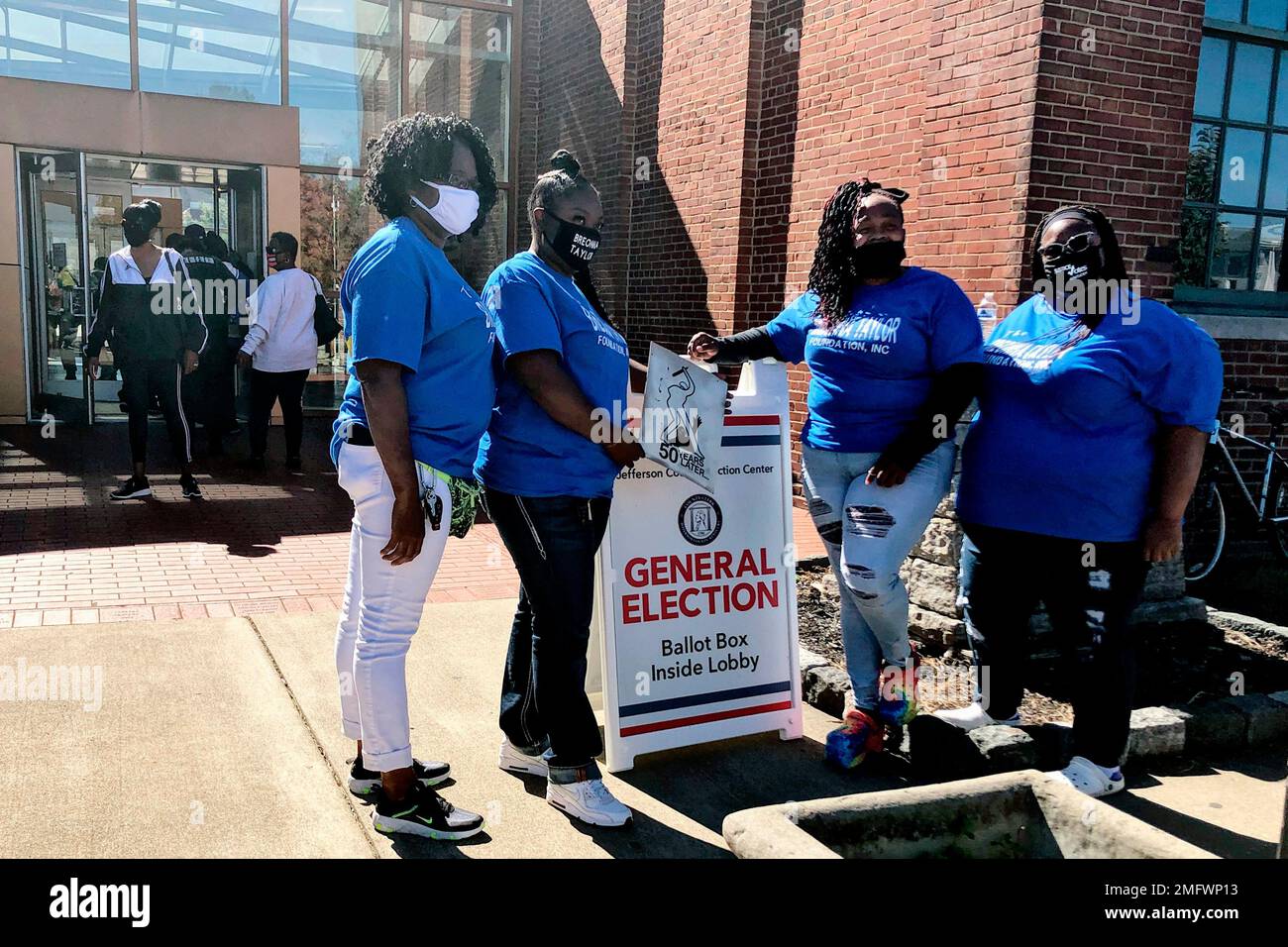 Breonna Taylor’s mother, Tamika Palmer, second from right, stands in