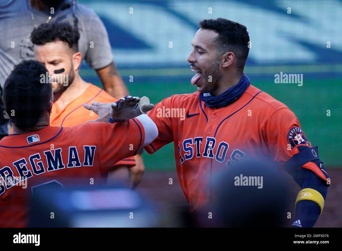 Houston Astros Carlos Correa is congratulated by Alex Bregman (after  hitting a solo home run Tampa Bay Rays relief pitcher Peter Fairbanks  during the sixth inning in Game 2 of a baseball