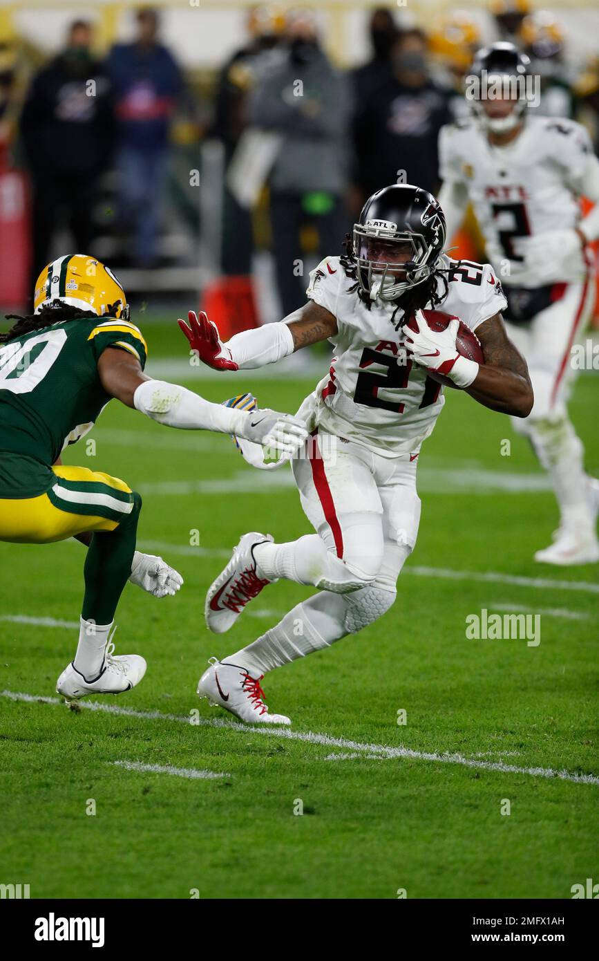 Atlanta Falcons running back Todd Gurley, 21, and Damontae Kazee, 27, walk  off the field after falling 30-26 to the Chicago Bears in an NFL football  game on Sunday, Sept. 27, 2020