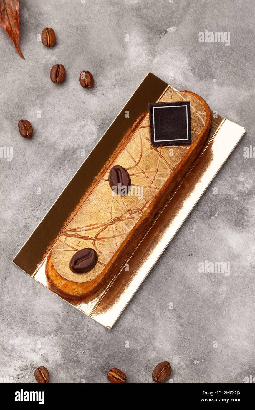 Delicious eclair with coffee flavoured cream filling garnished with