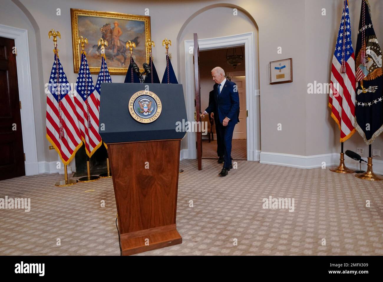 US President Joe Biden walks to the podium to announce the transfer of ...