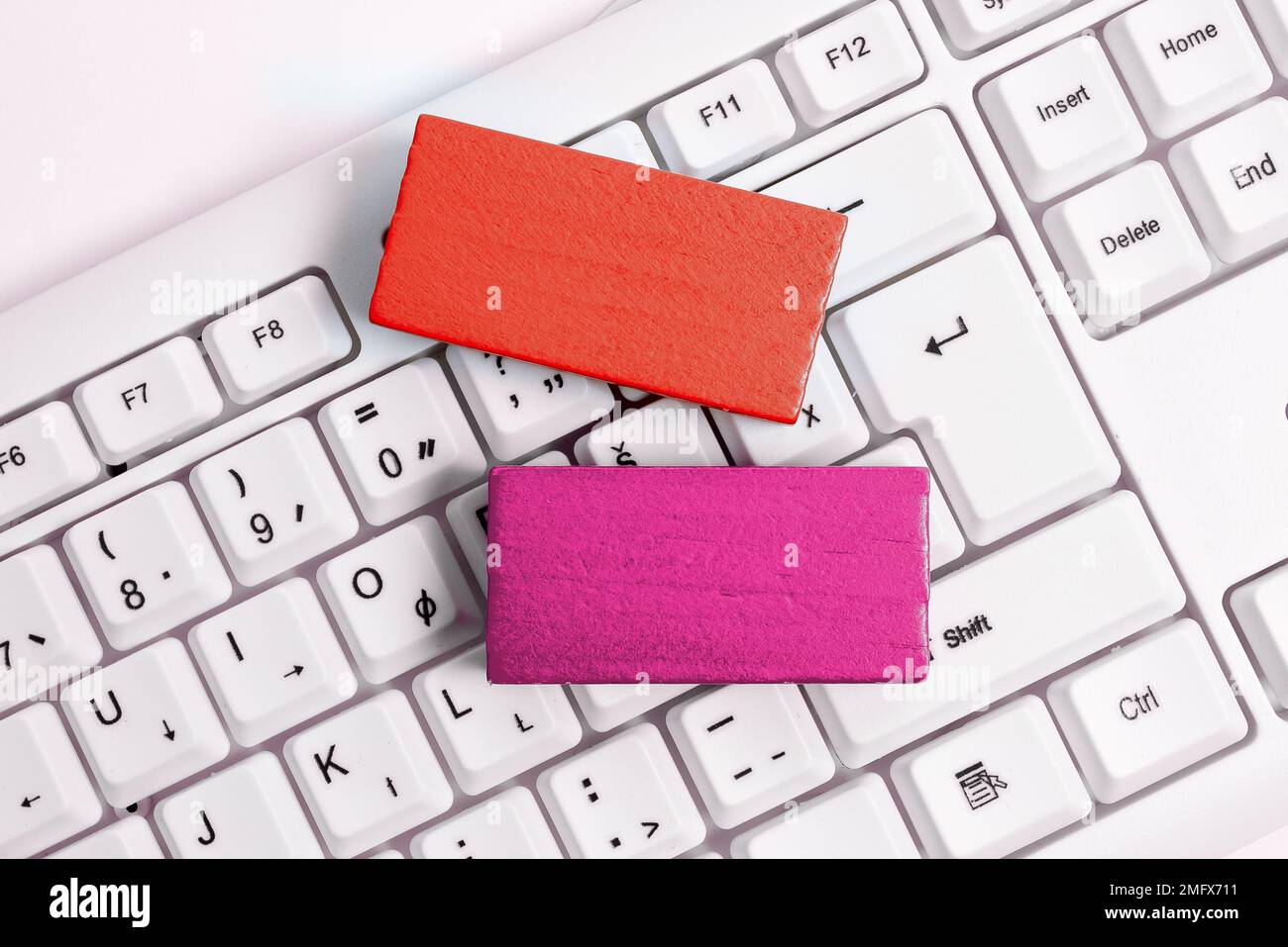 Colored cube with important message lying on keyboard. Main information. Stock Photo