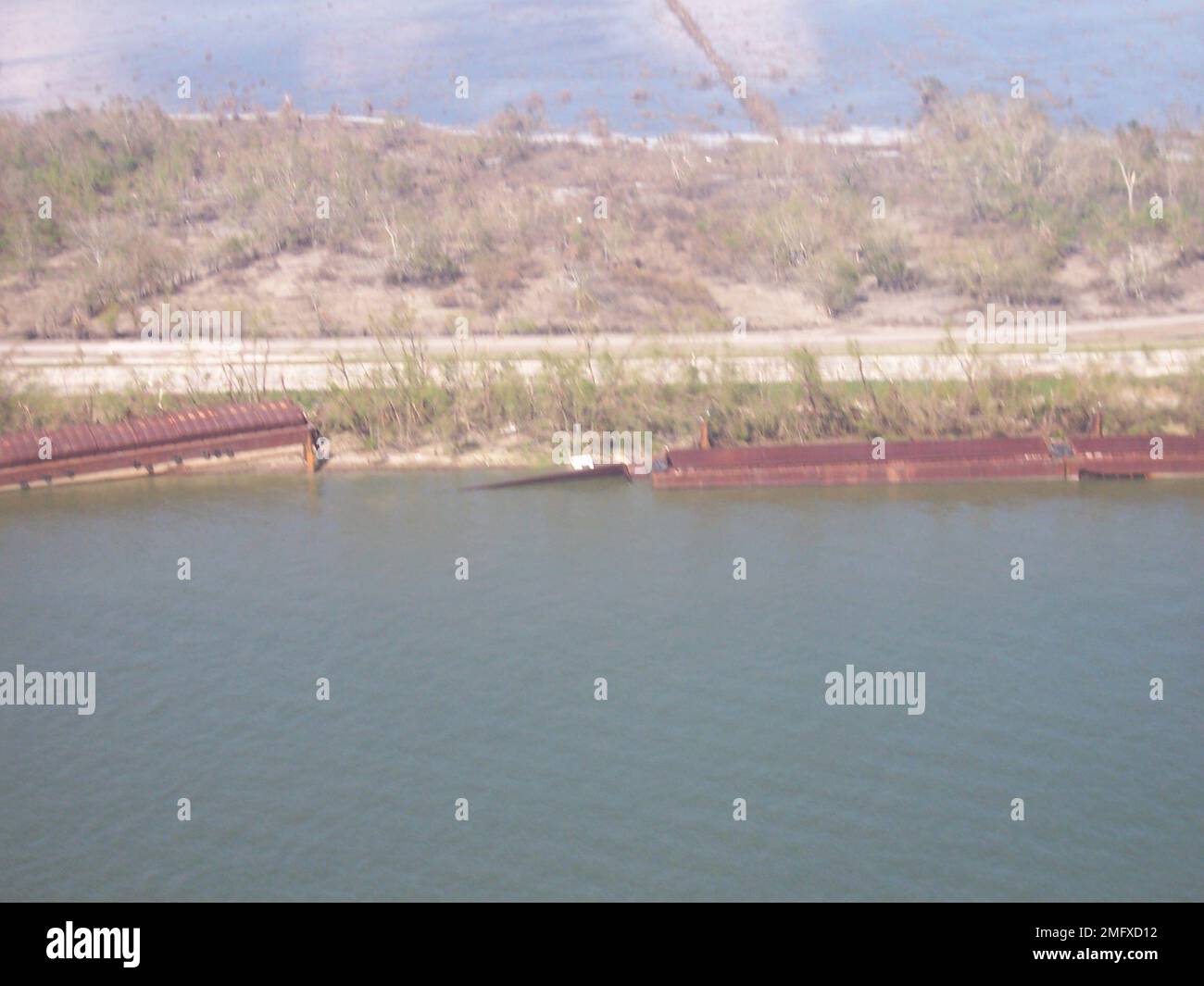 Overflight - Potter - Pilottown and North - 26-HK-211-99. 29 38.362N 089 56.310W; Grounded Barges. Hurricane Katrina Stock Photo