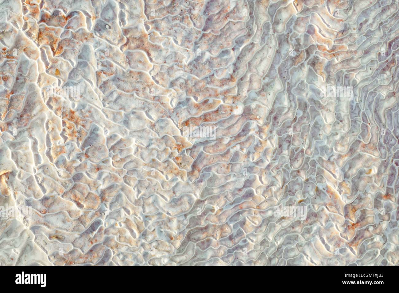 Texture of lime deposits on limestone hills of Pamukkale thermal