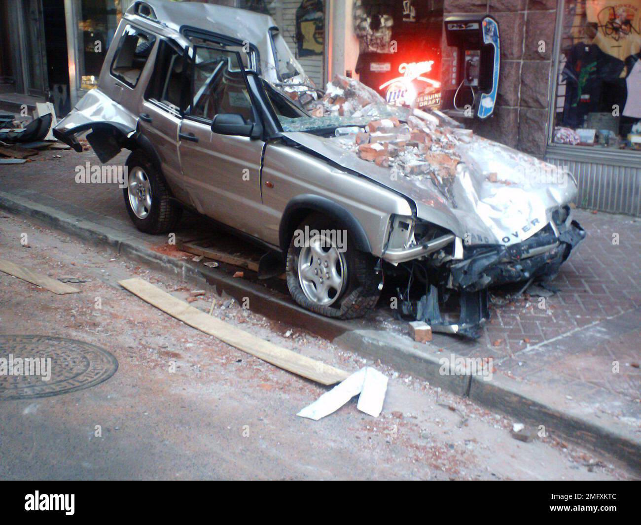 Aftermath - Miscellaneous - 26-HK-47-135. destroyed car with brick ...