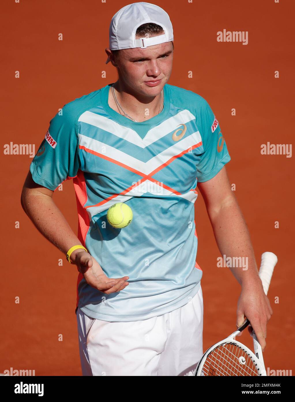Switzerlands Dominic Stephan Stricker serves against Switzerlands Leandro Riedi in the junior mens final match of the French Open tennis tournament at the Roland Garros stadium in Paris, France, Saturday, Oct
