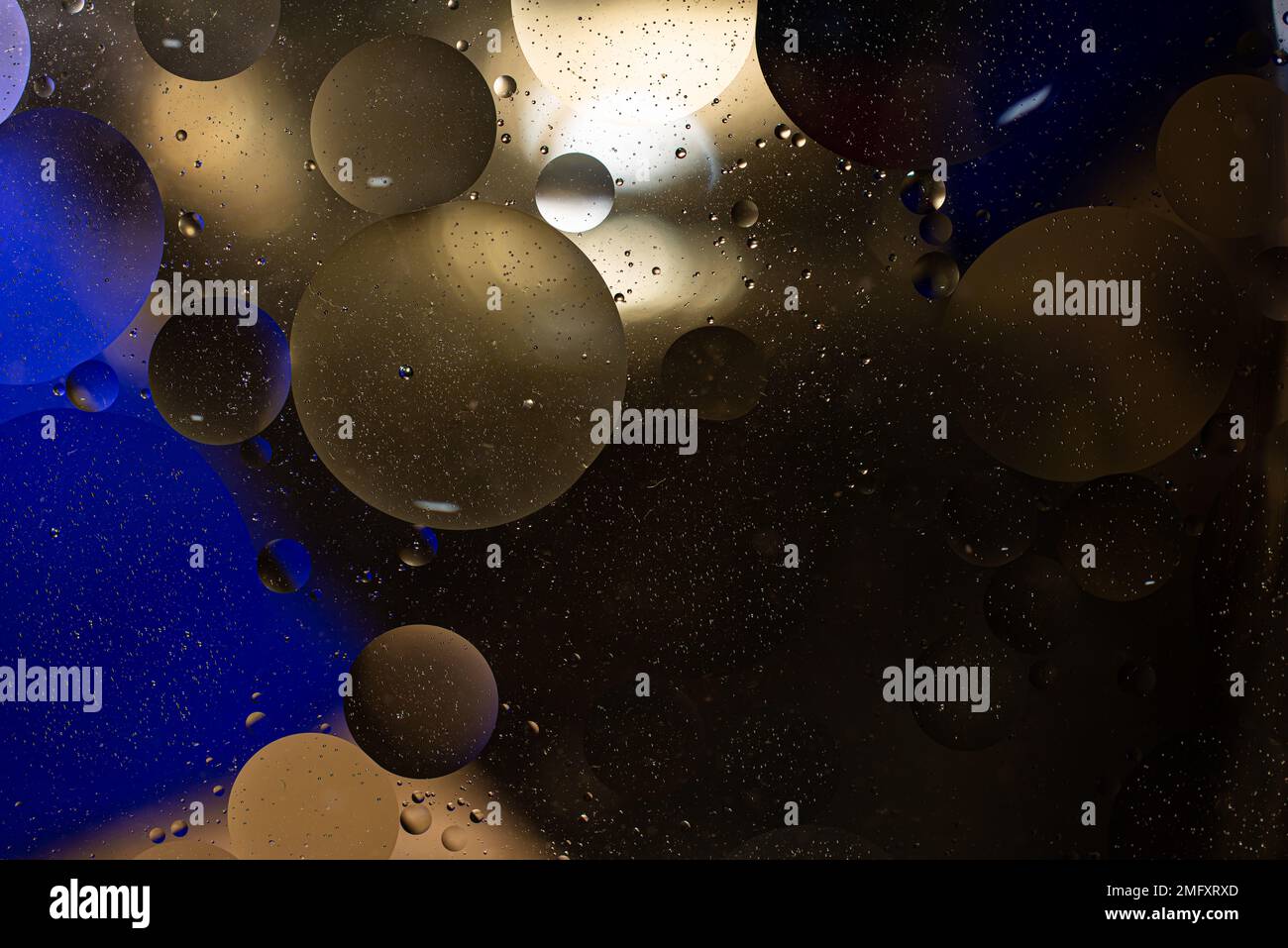 Photo of oil on a water surface with bubbles. Abstract colorful background. Macro close-up, not illustration . Stock Photo