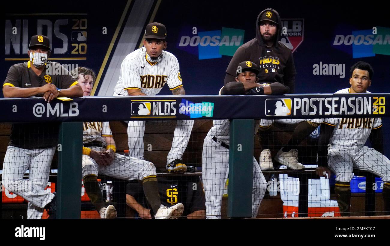 San Diego Padres watch play while trailing the Los Angeles Dodgers during the sixth inning in Game 3 of a baseball National League Division Series Thursday, Oct