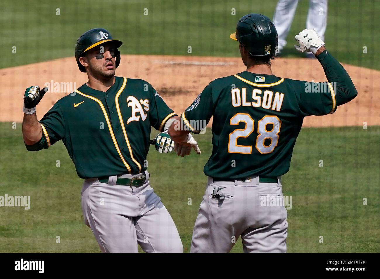 Oakland Athletics' Ramon Laureano, left, is tagged out by Houston