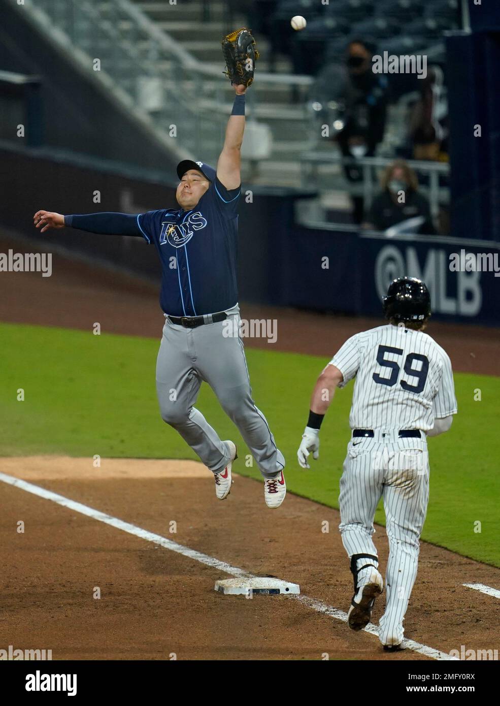 August 9 2021: New York first baseman Luke Voit (59) makes a play