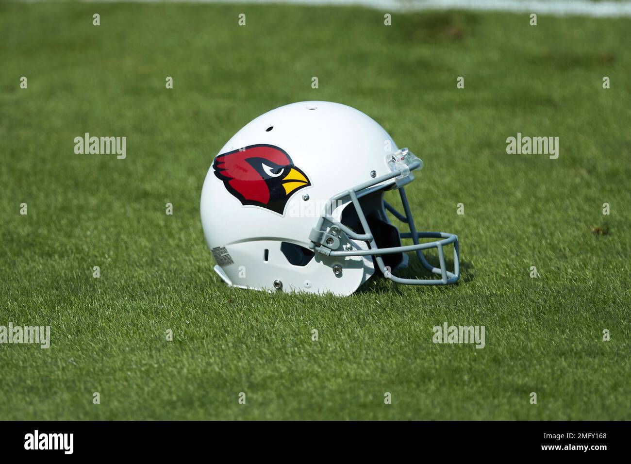 An Arizona Cardinals helmet sits on the sideline before a