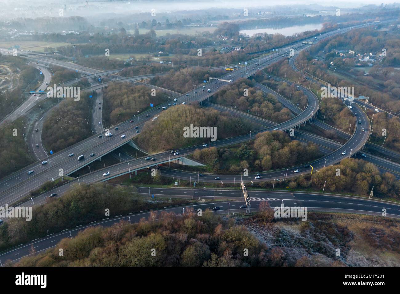 Aerial view of the junction of the M25 (junction 12) and M3 (junction 2) motorways in Chertsey, Egham, Surrey, UK. Stock Photo