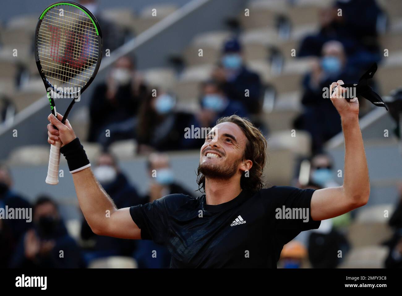 Greeces Stefanos Tsitsipas celebrates winning his quarterfinal match of the French Open tennis tournament against Russias Andrey Rublev in three sets, 7-5, 6-2, 6-3, at the Roland Garros stadium in Paris, France,