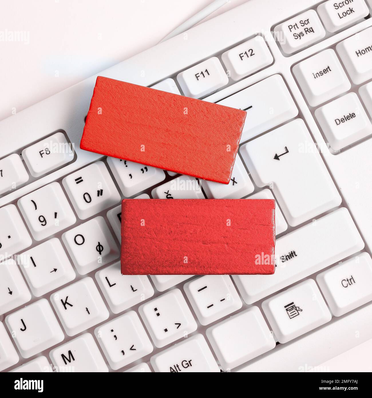 Colored cube with important message lying on keyboard. Main information. Stock Photo