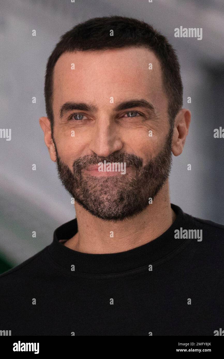 Designer Nicolas Ghesquiere accepts applause at the end of the