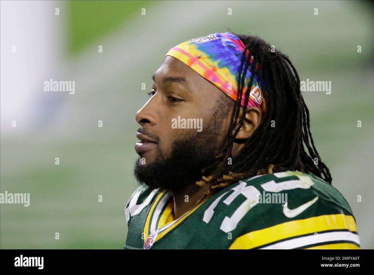 Green Bay Packers' Aaron Jones wears a Crucial Catch headband as he leaves  the field following an NFL football game against the Atlanta Falcons,  Monday, Oct. 5, 2020, in Green Bay, Wis. (