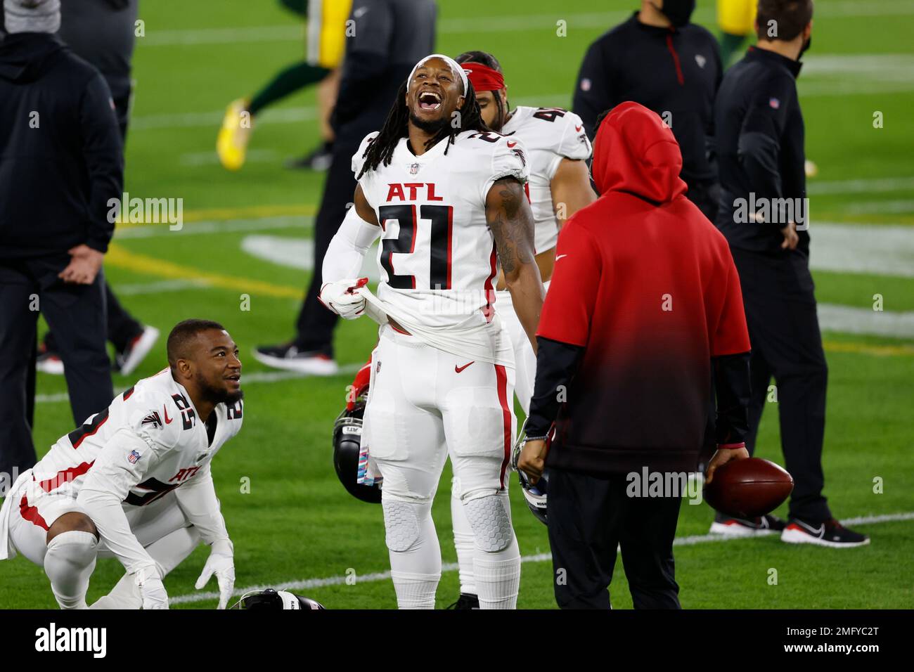 Atlanta Falcons running back Todd Gurley, 21, and Damontae Kazee, 27, walk  off the field after falling 30-26 to the Chicago Bears in an NFL football  game on Sunday, Sept. 27, 2020