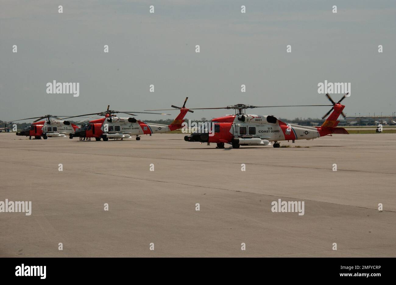 Aircrafts - HH-60 Jayhawk - 26-HK-53-55. HH-60s on ramp --- 050830. Hurricane Katrina Stock Photo