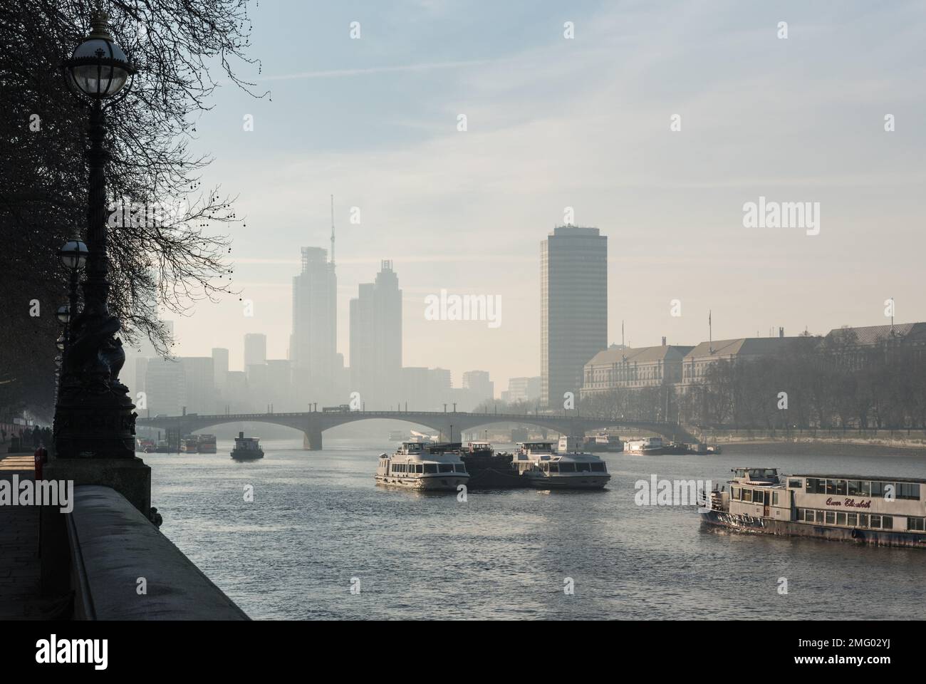Winter view from the Albert Embankment towards Lambeth Bridge and Vauxhall on a misty day Stock Photo