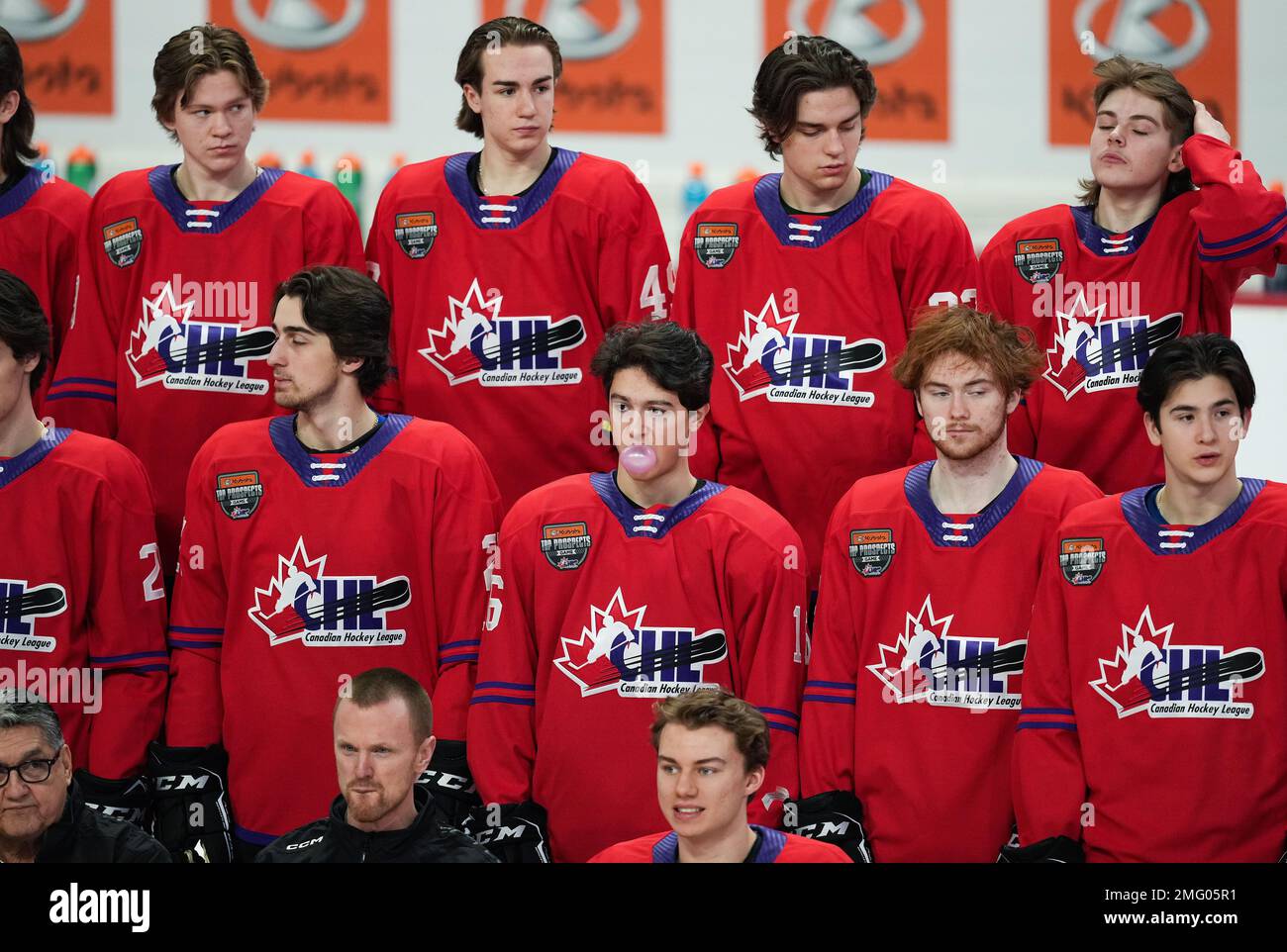 Hamilton Bulldogs' Nick Lardis, centre, blows a bubble while chewing