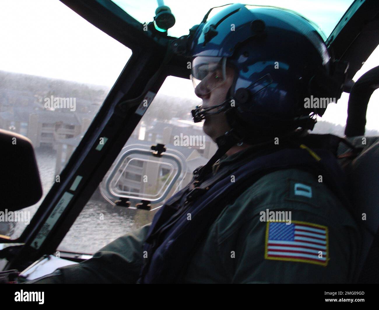 Coast Guard Personnel - Miscellaneous - 26-HK-90-75. CG pilot flying in ...