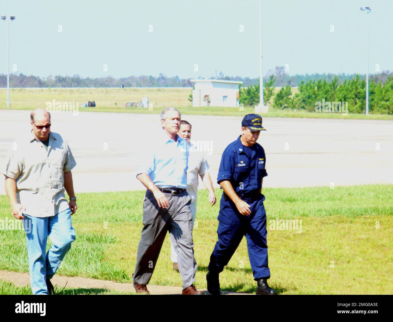 . President Bush and CAPT David Callahan (CO ATC Mobile) near flight line. Hurricane Katrina Stock Photo