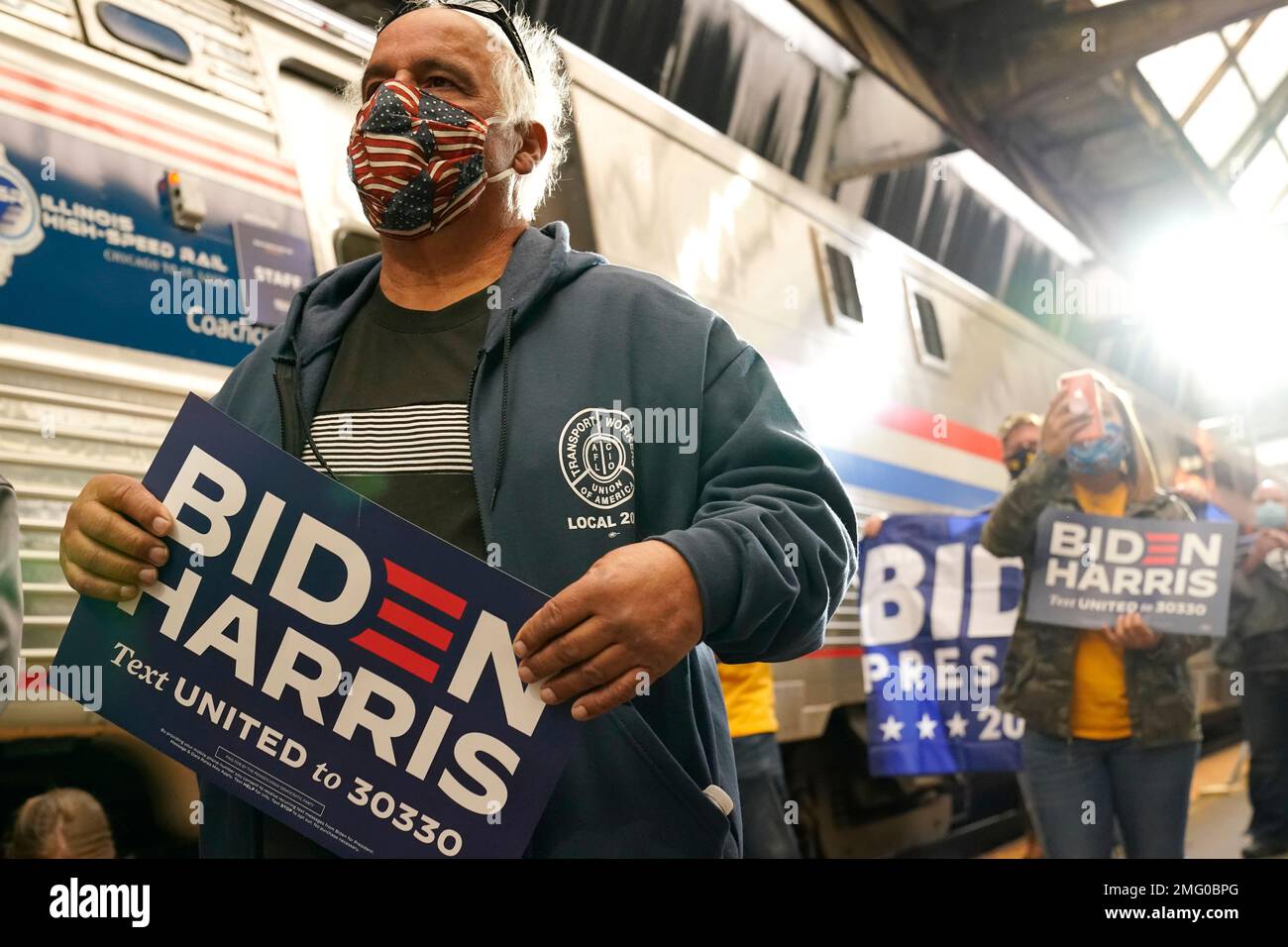 Supporters listen as Democratic presidential candidate former Vice ...