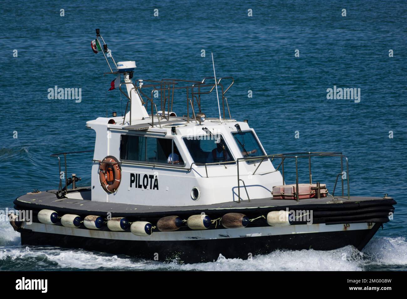 Pilot boat used to transport maritime pilots between land and the inbound or outbound ships that they are piloting. Stock Photo
