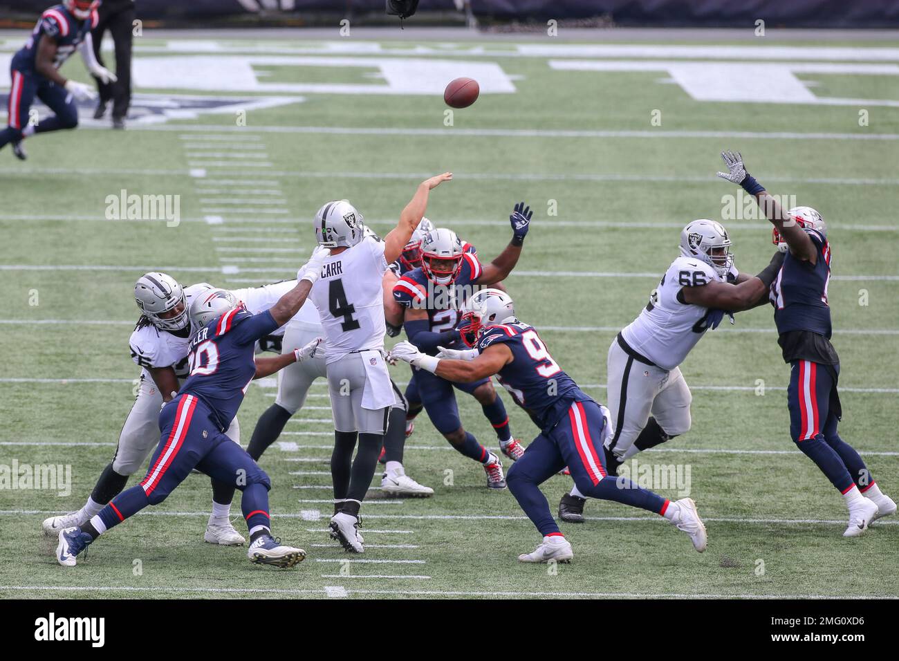 Las Vegas Raiders quarterback Derek Carr throws a pass under pressure  during the first half of an NFL football game against the Houston Texans,  Sunday, Oct. 23, 2022, in Las Vegas. (AP