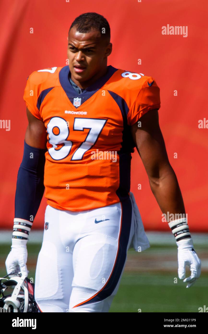 Denver Broncos tight end Noah Fant (87) walks on the field while